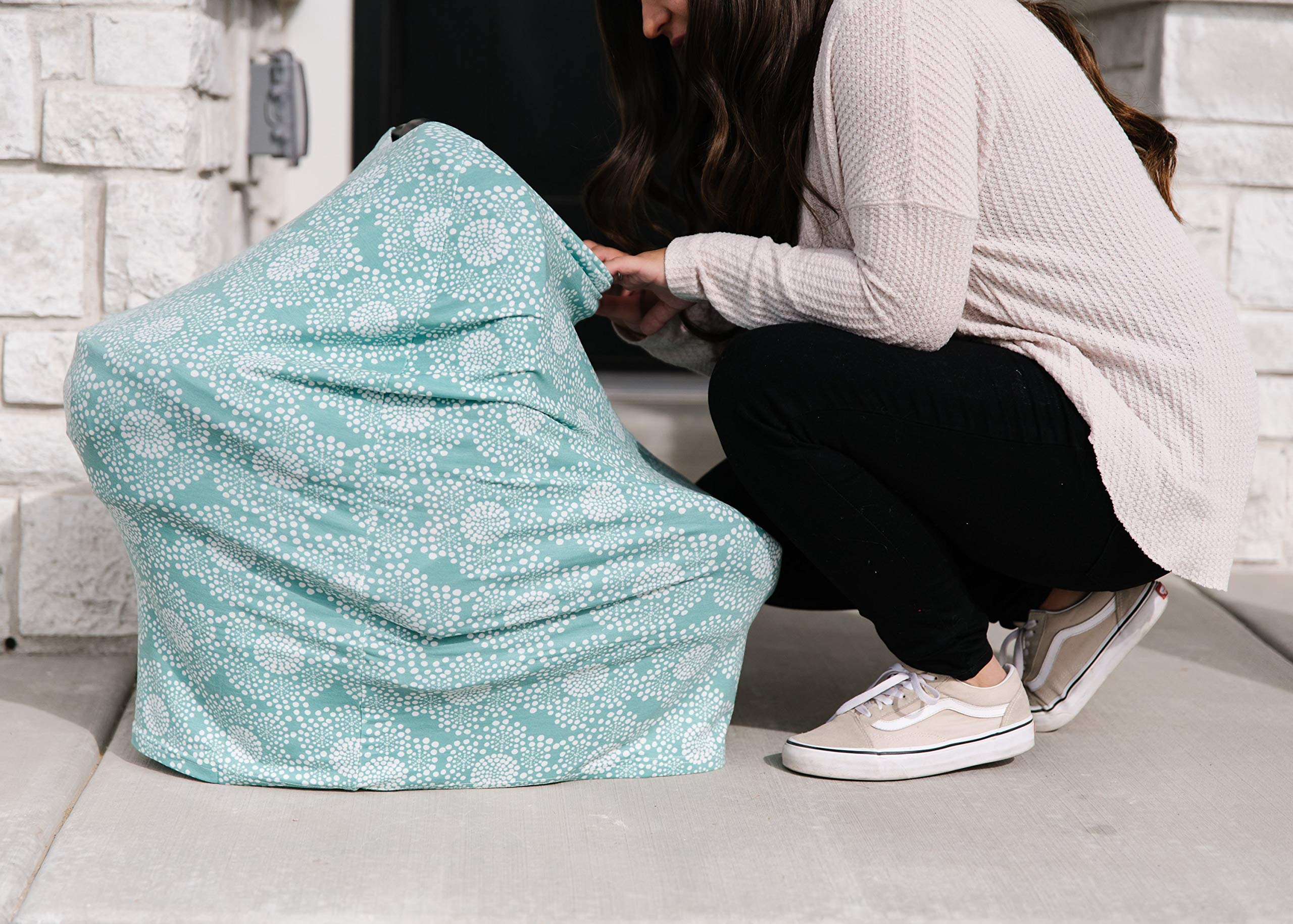Car seat cover by Copper Pearl Jane provides full coverage while keeping baby visible.