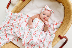Copper Pearl Jolly swaddle demonstrates versatile newborn wrapping and easy blanket use