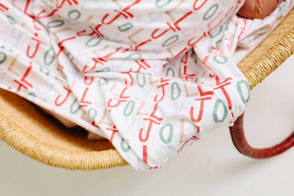 Copper Pearl Jolly swaddle gift-pack image suggests a thoughtful baby shower present
