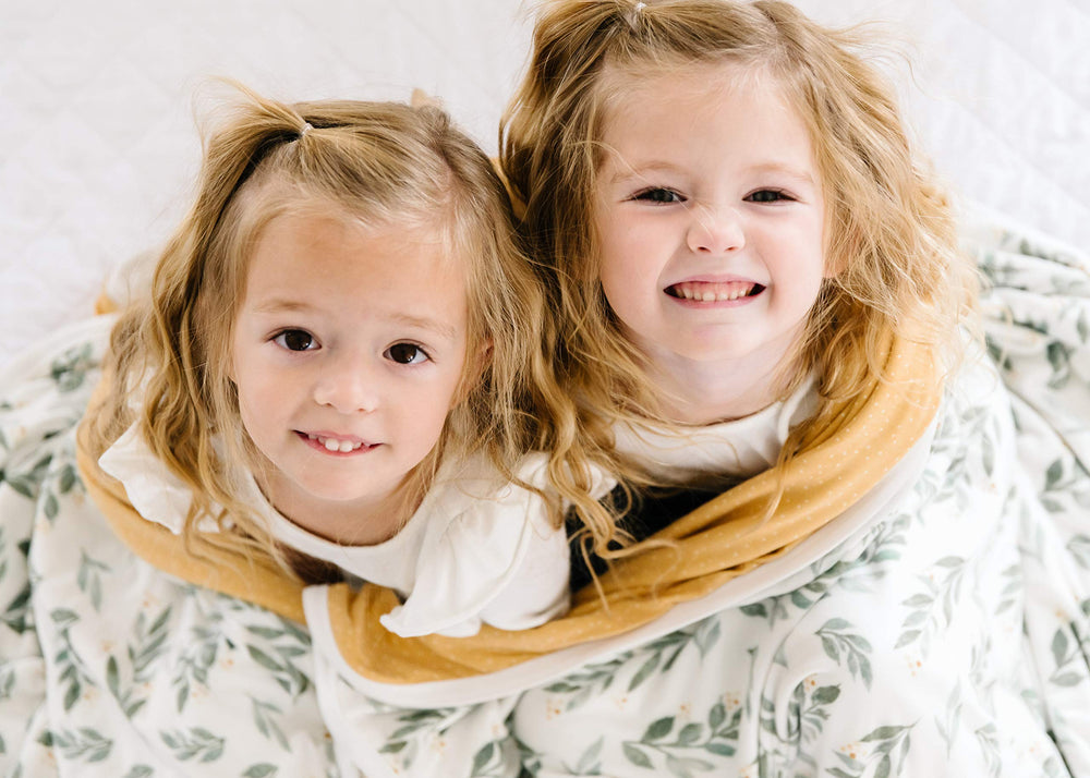 Copper Pearl Jumbo 3-Layer Blanket cozy quilt in crib setting.