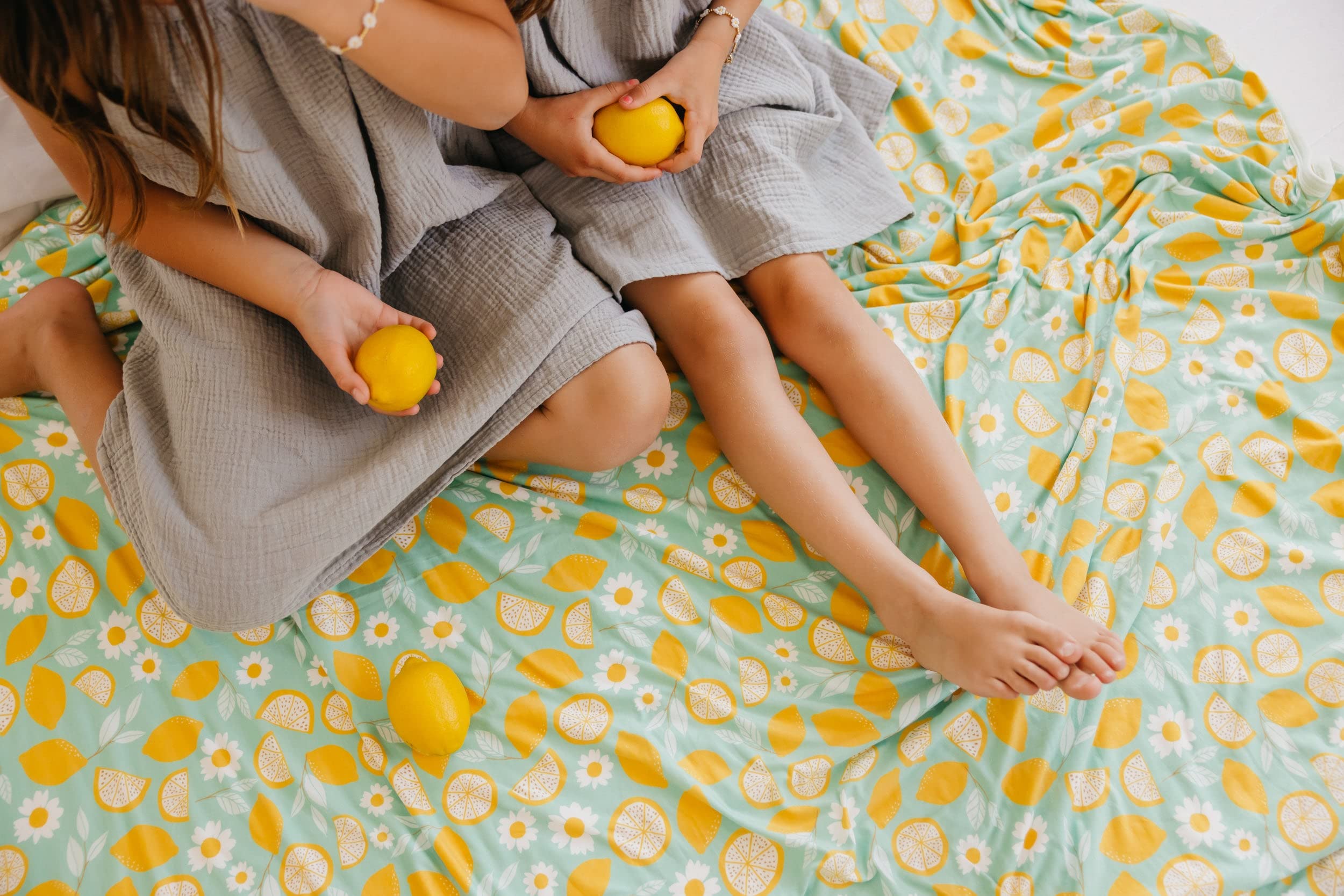 Copper Pearl jumbo quilt lemon coordinates with Copper Pearl prints in nursery