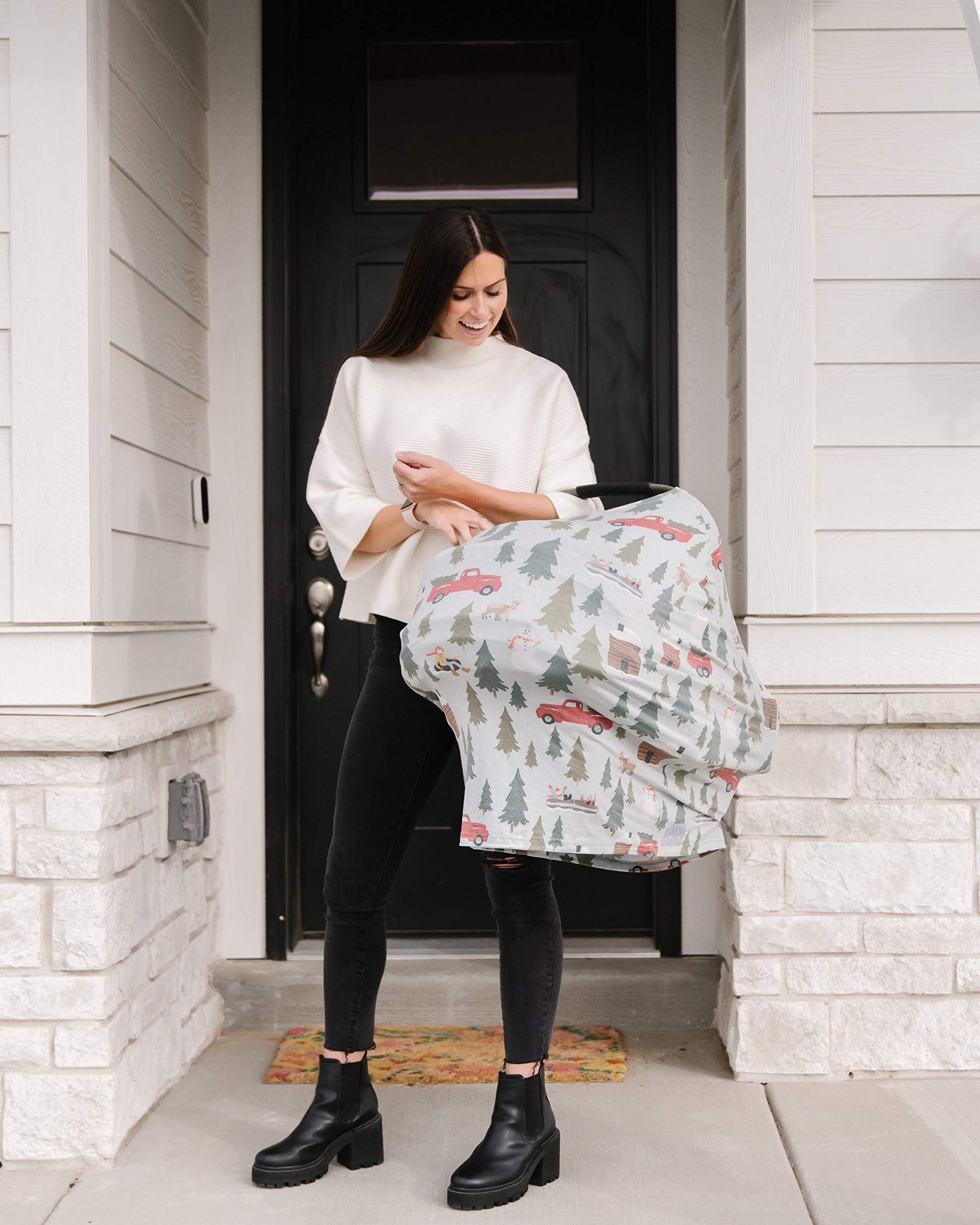 Copper Pearl Kringle shopping cart cover in use protects baby during shopping