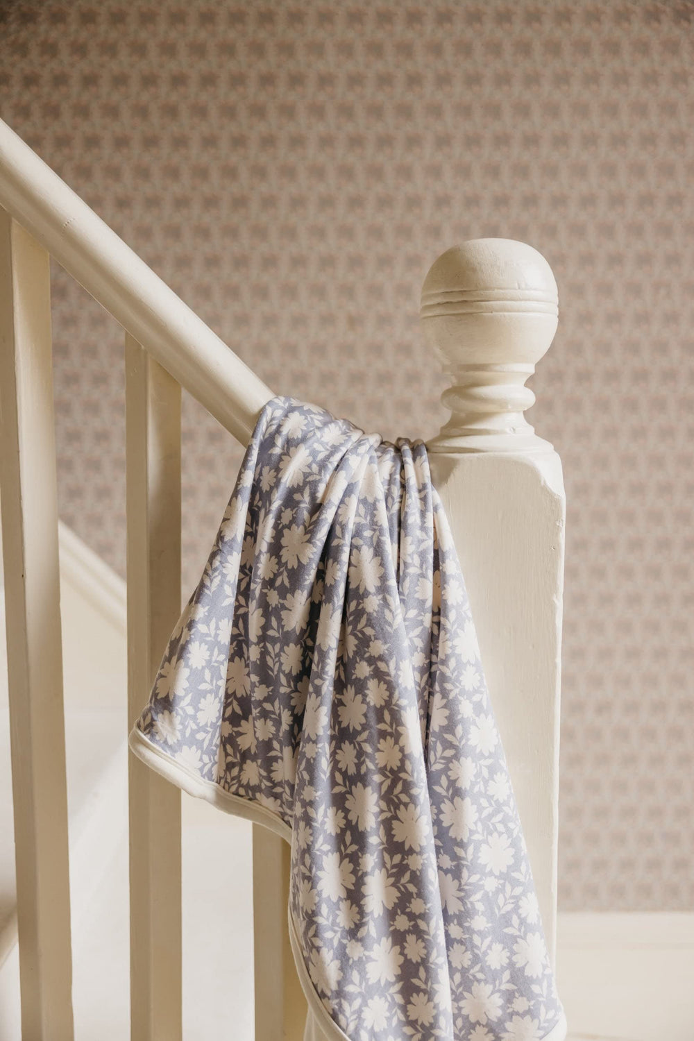 Copper Pearl Lacie blanket wrapped as a gift with modern pattern.