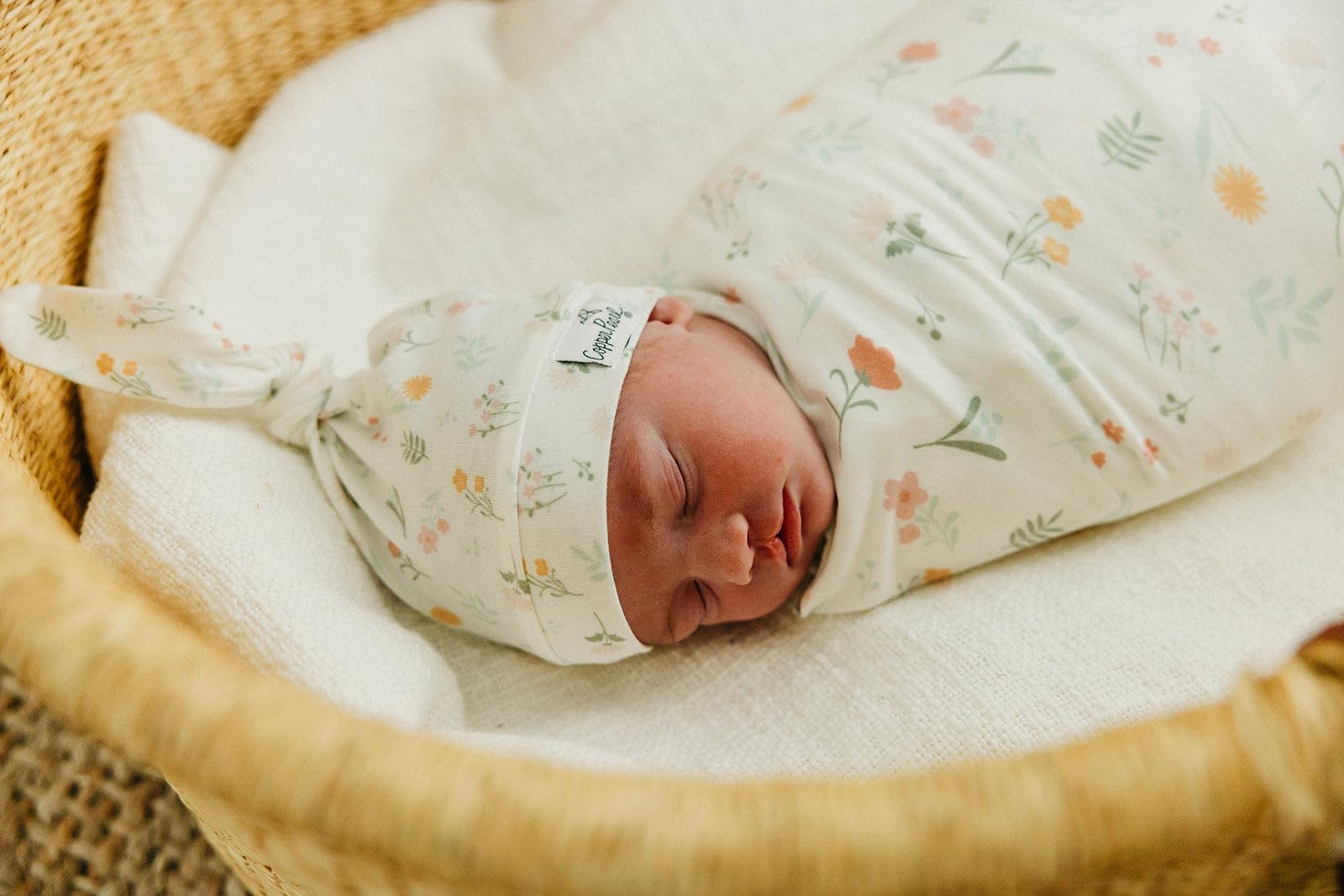 Copper Pearl large-knit blanket as receiving wrap in nursery