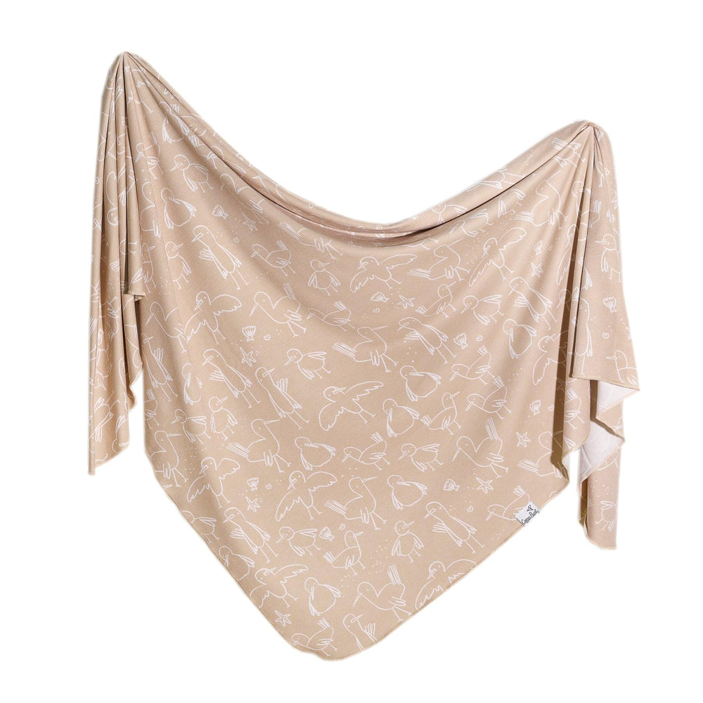 Copper Pearl large premium knit swaddle sandy blanket offers soft, breathable warmth for newborns.