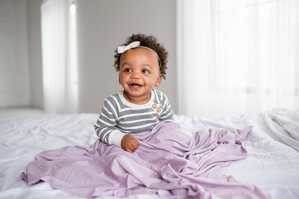 Copper Pearl Lily swaddle wrap doubles as a receiving blanket for growing babies.