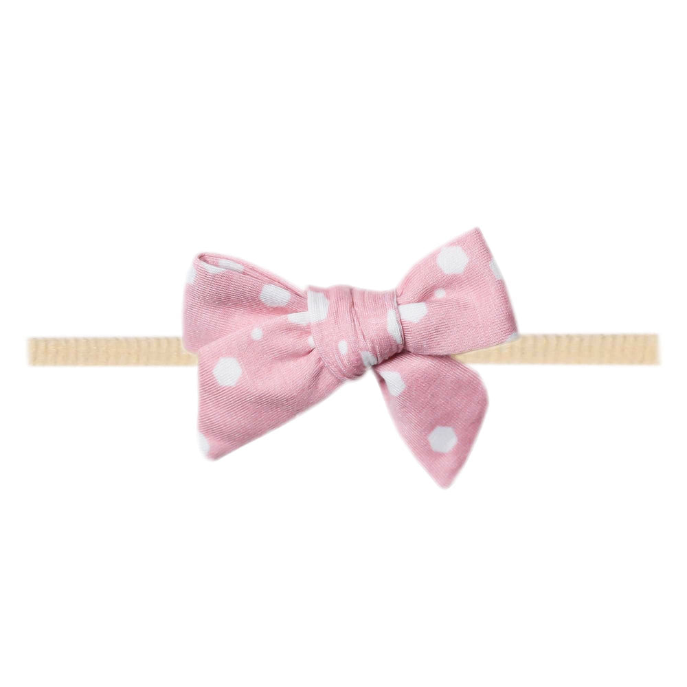 Copper Pearl Lucy Classic baby bow front view, soft fabric for newborn comfort