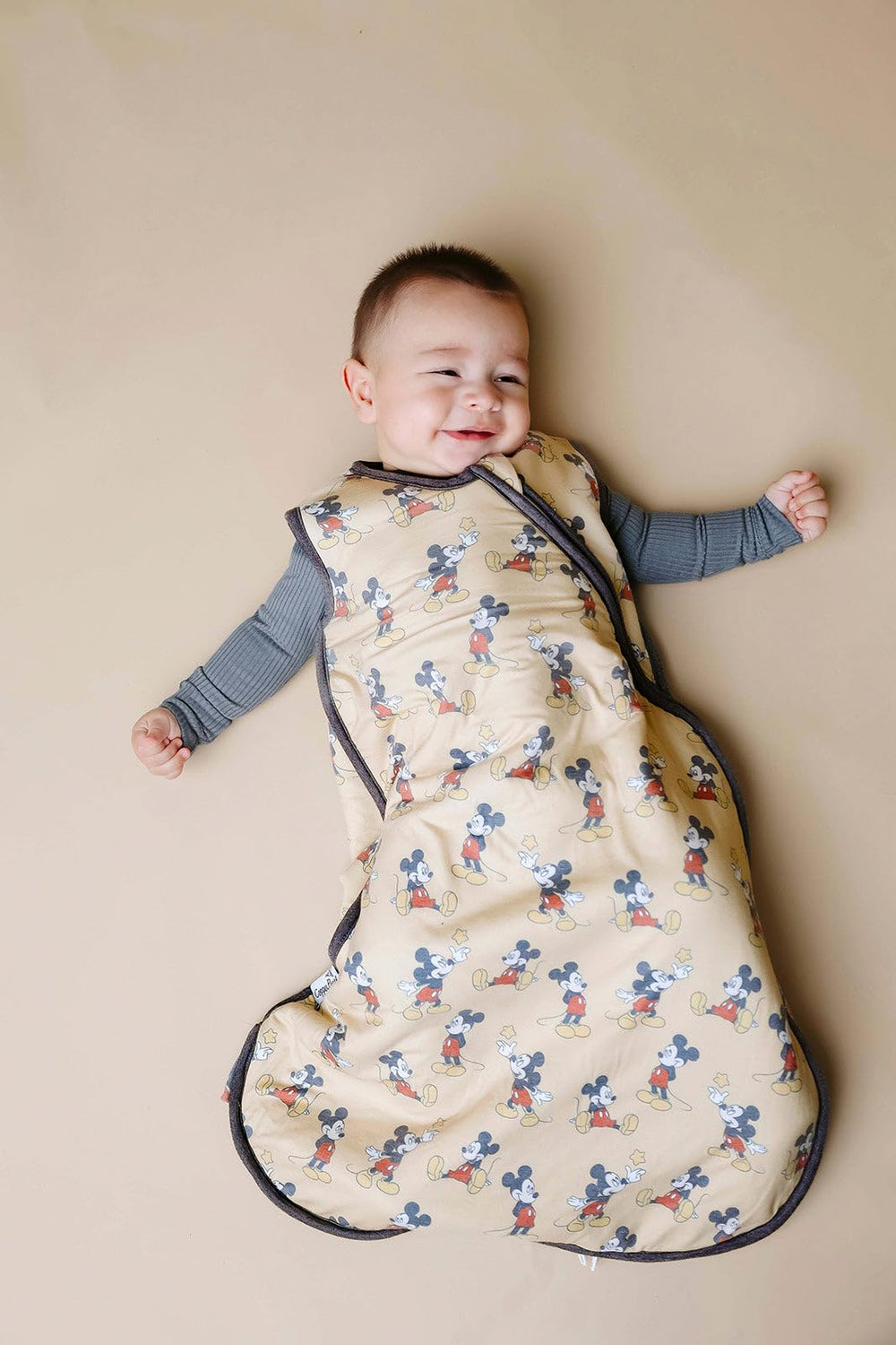 Mickey Mouse sleep bag close-up reveals soft knit fabric and stretch.