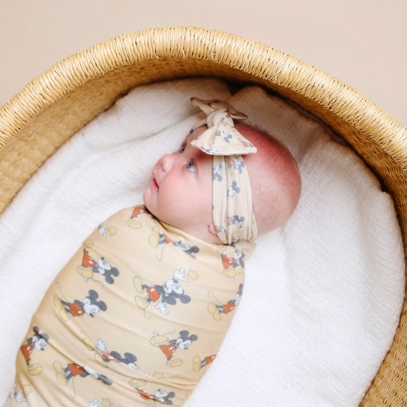 Copper Pearl Mickey Mouse swaddle shows large 46x46 inch design ideal as baby grows.