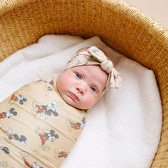 Copper Pearl Mickey Mouse swaddle close-up of premium knit fabric for gentle cuddling.