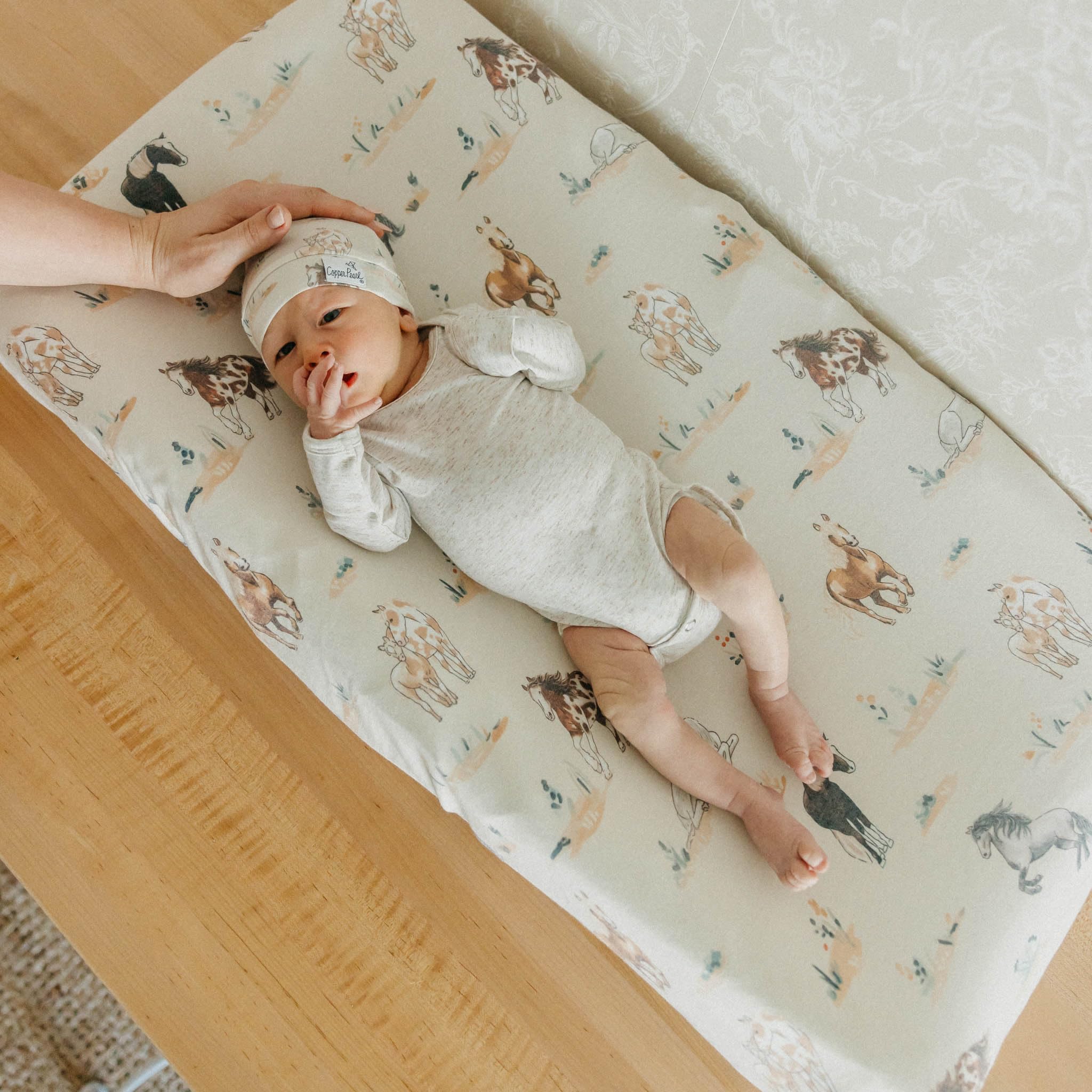Montana knitting on Copper Pearl changing pad cover ready for daily use and care