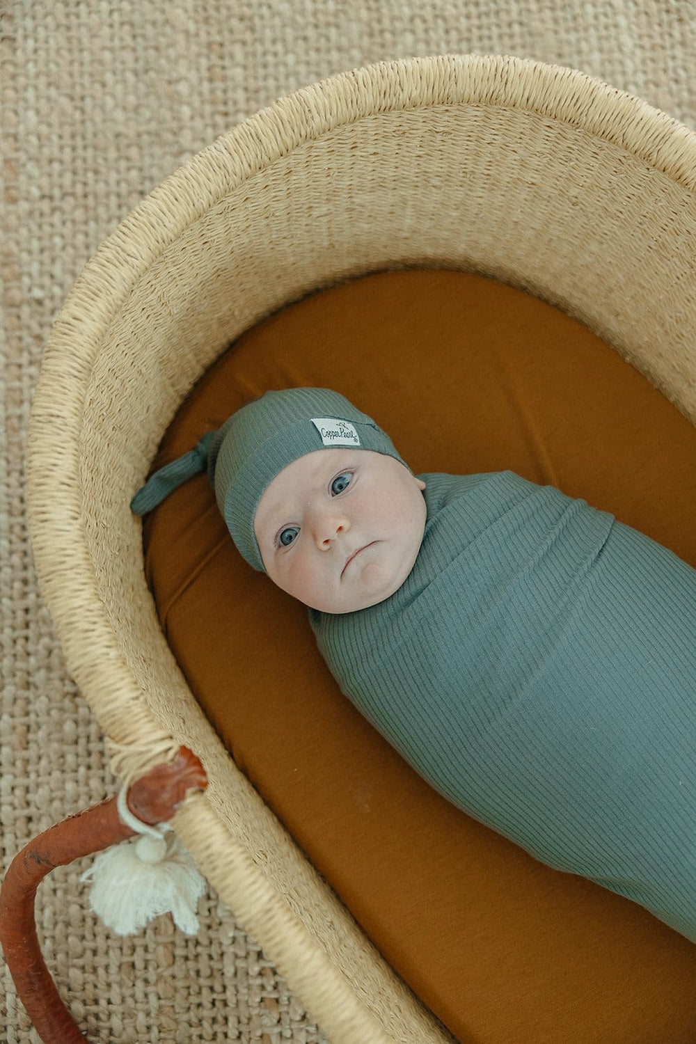 Copper Pearl Moss swaddle blanket used as a nursing cover for discreet feedings.