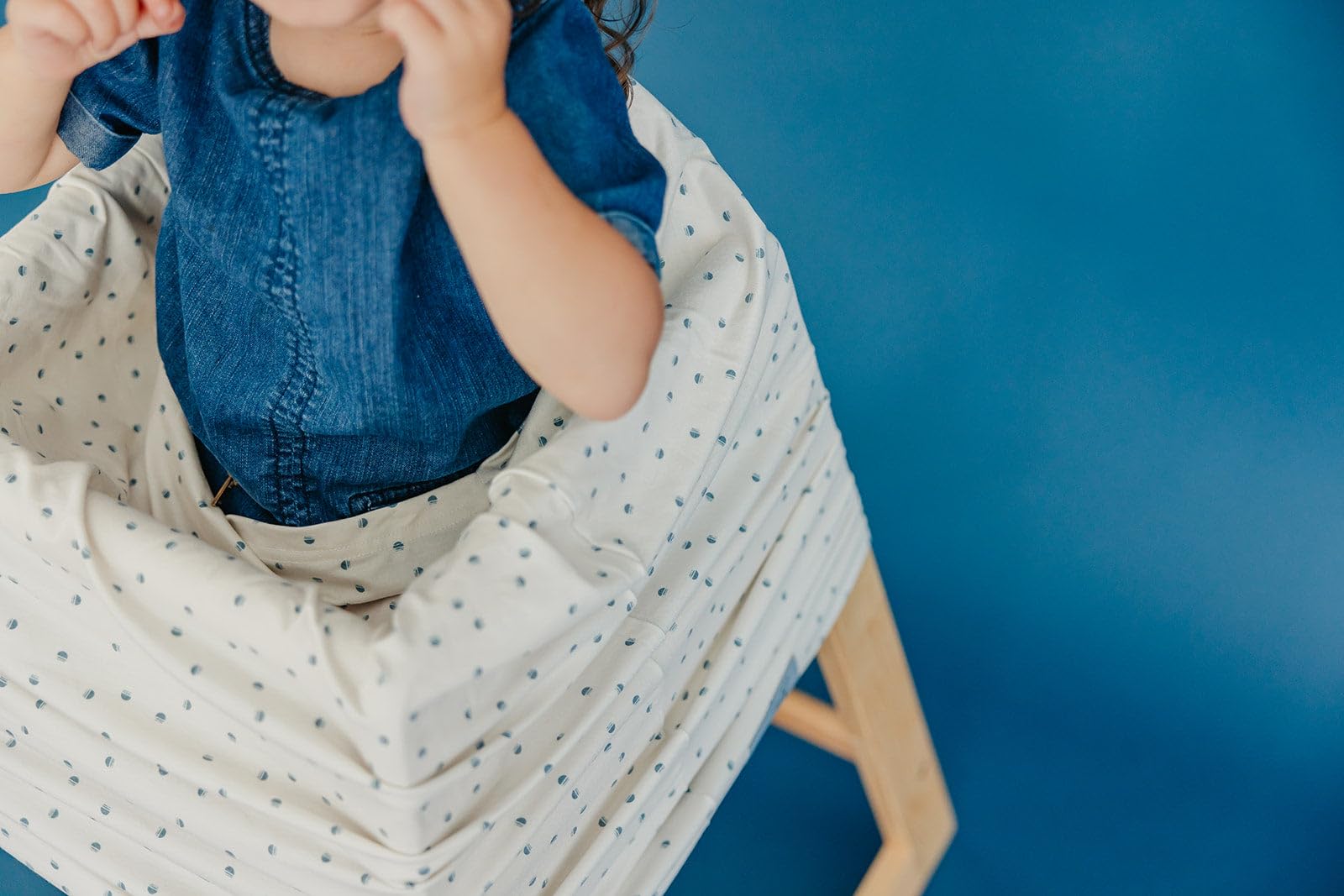 Copper Pearl easy-access cover keeps baby in sight during activities.