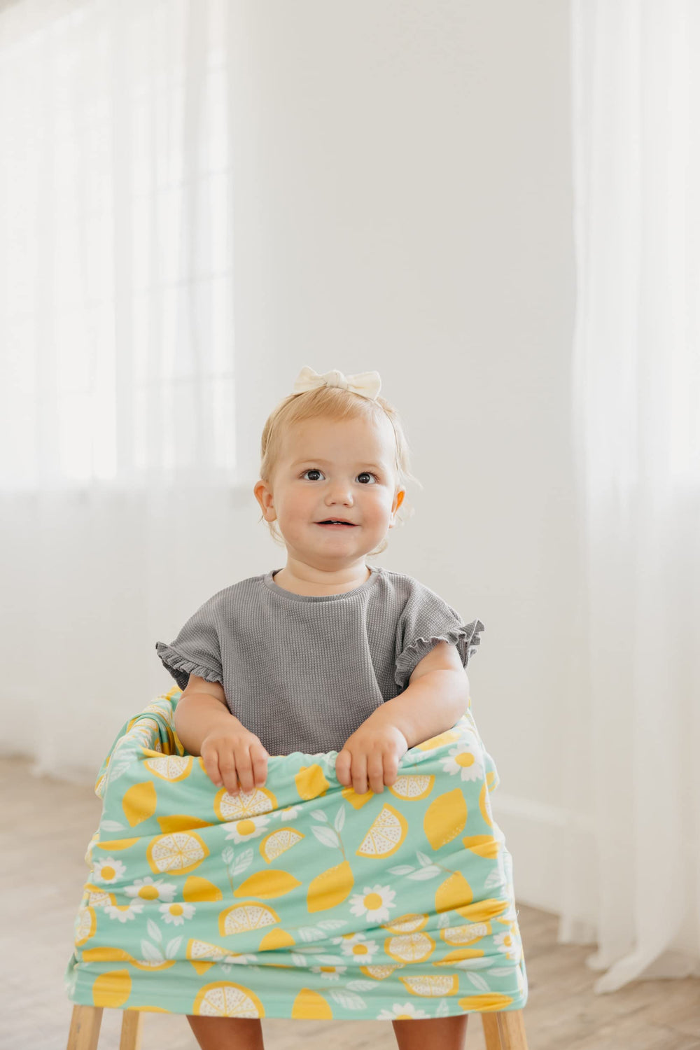 Copper Pearl Lemon stretchy-rayon-blend cover shown on a car seat for universal fit.