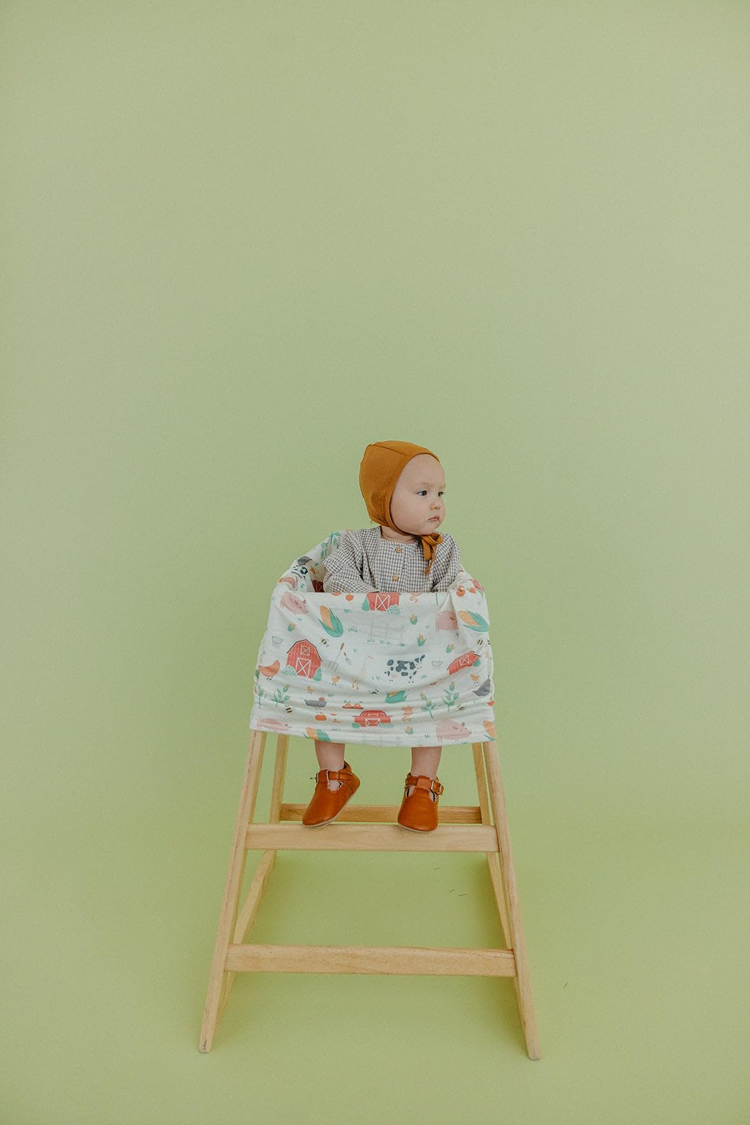 Copper Pearl shopping cart cover keeps baby comfy in crowded stores.