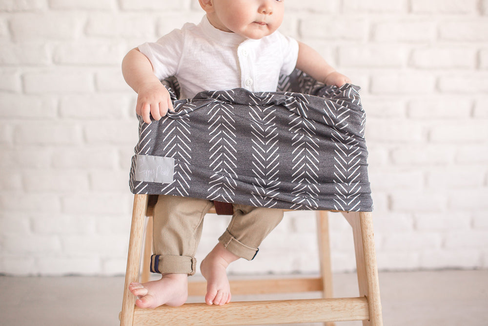 Copper Pearl multi-use cover shopping-cart cover keeps baby comfy and clean during errands.