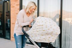 Copper Pearl shopping-cart cover protects baby from germs during busy errands.