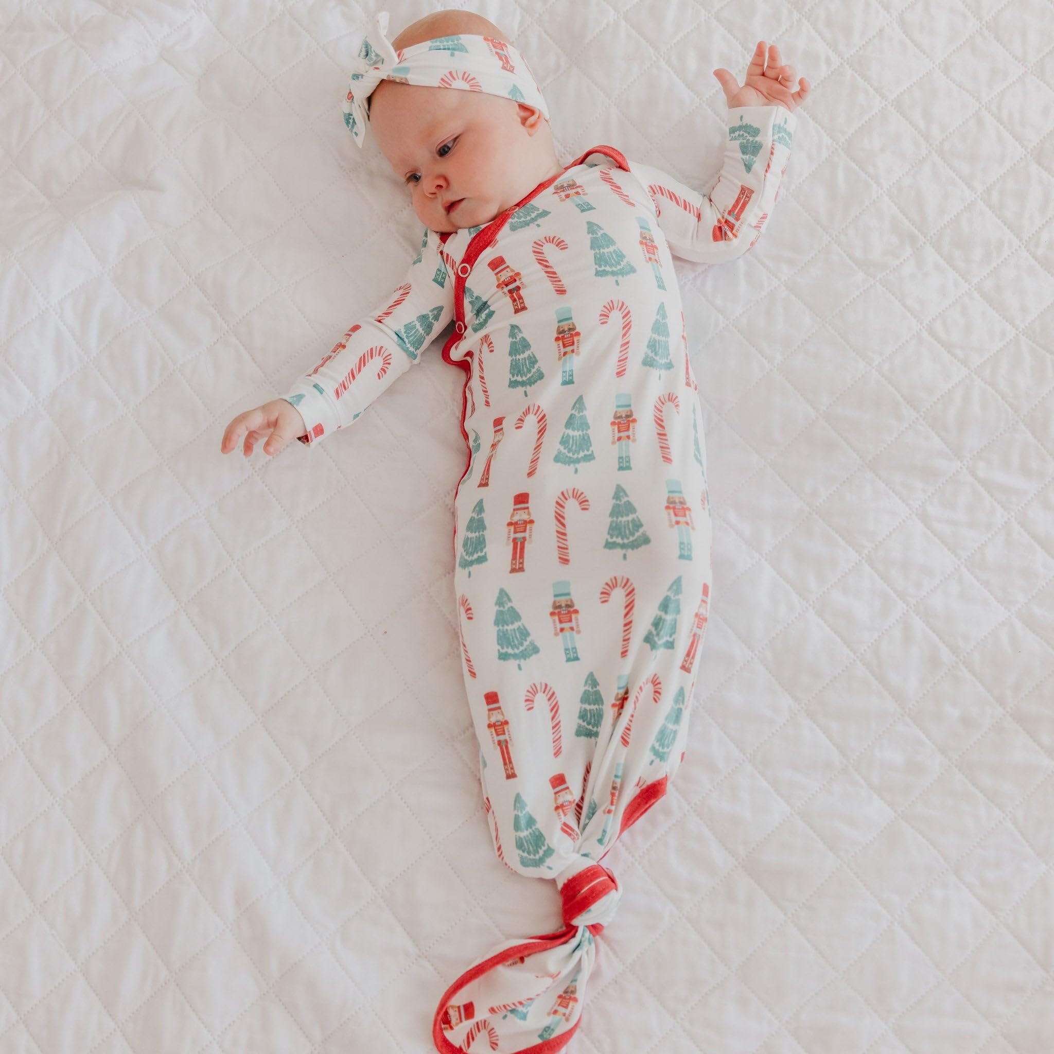 Copper Pearl Nicholas gown on baby in crib showing coordinated prints.