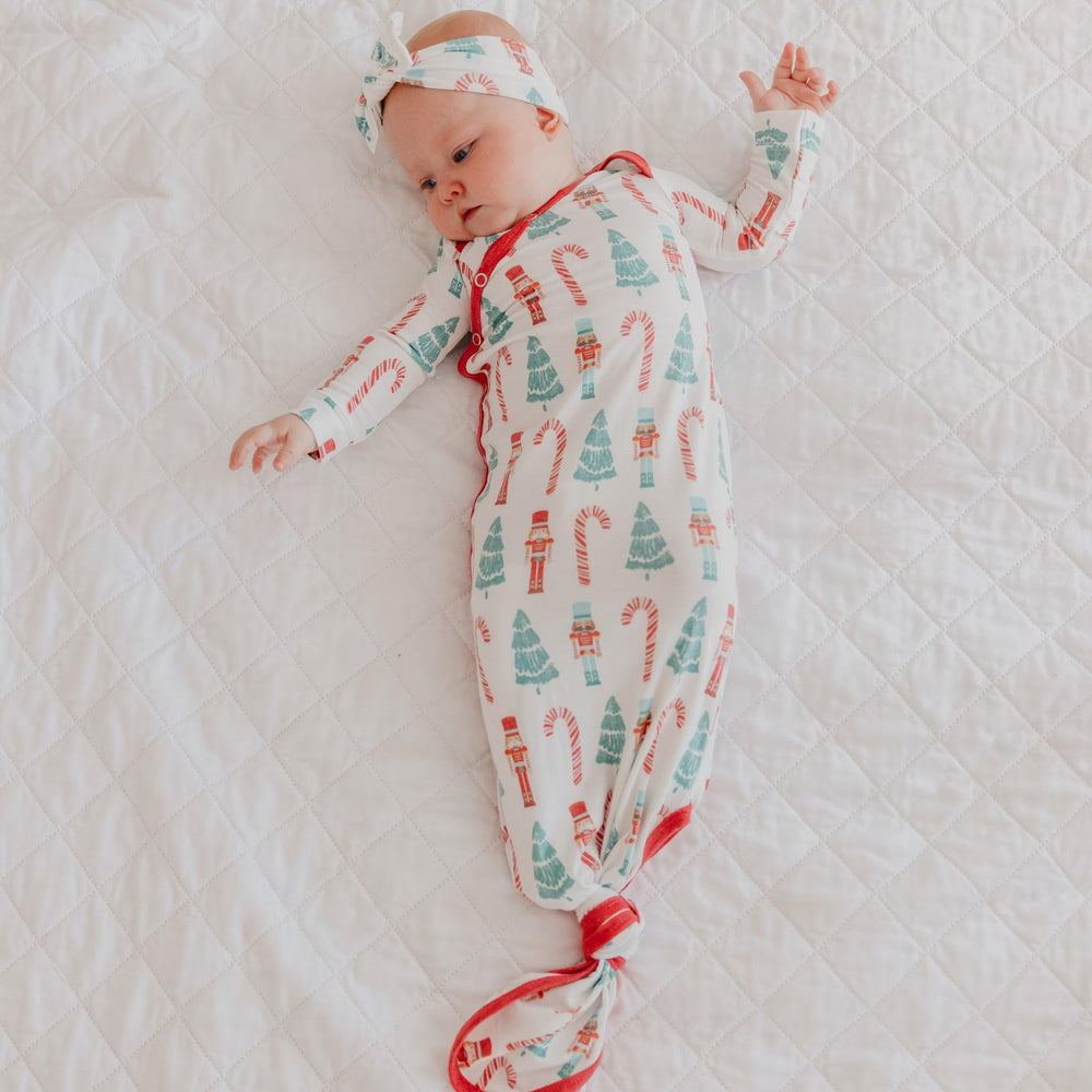 Copper Pearl Nicholas gown on baby in crib showing coordinated prints.