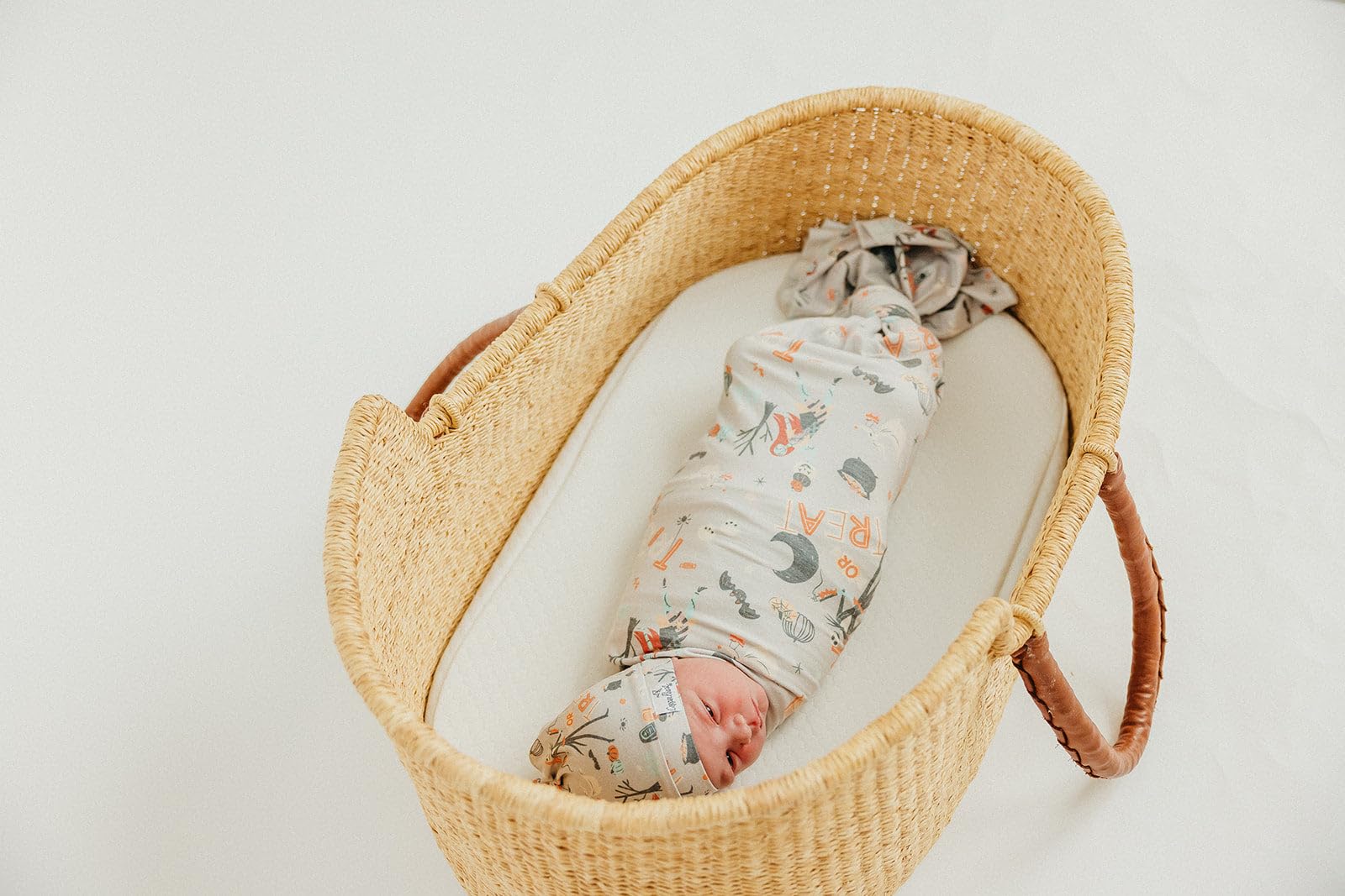 Copper Pearl Nightmare Before Christmas swaddle blanket in use as playmat demonstrates versatility.