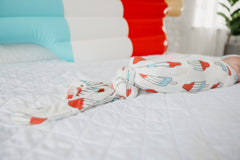 Copper Pearl nursing-cover-blanket supports easy feeding while keeping baby comfortable.