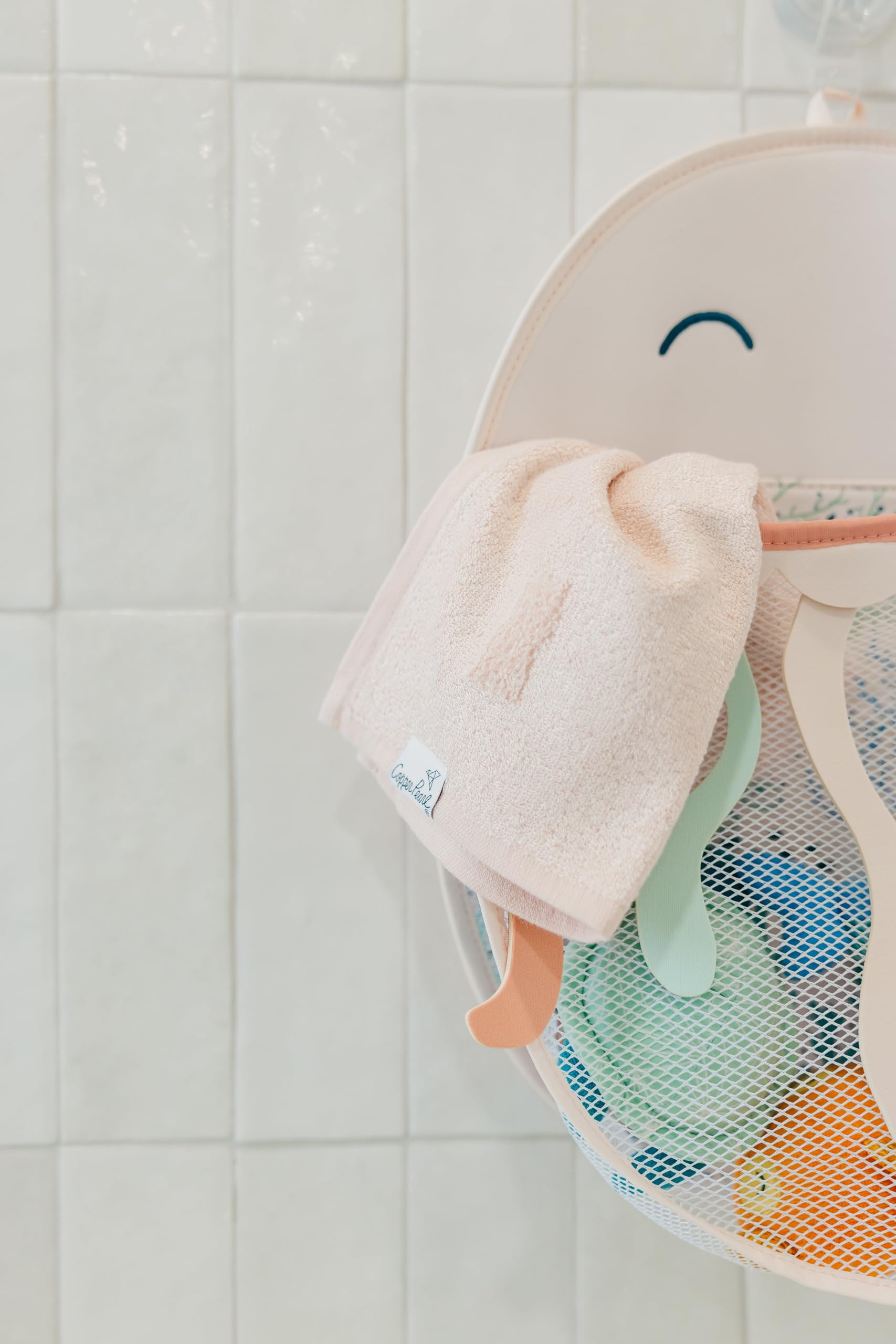 Copper Pearl Oceana characters Finn, Cora, and Wade brighten bath time as toys are stored.