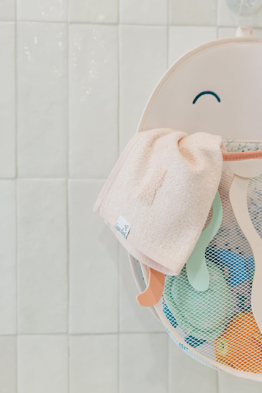 Copper Pearl Oceana characters Finn, Cora, and Wade brighten bath time as toys are stored.