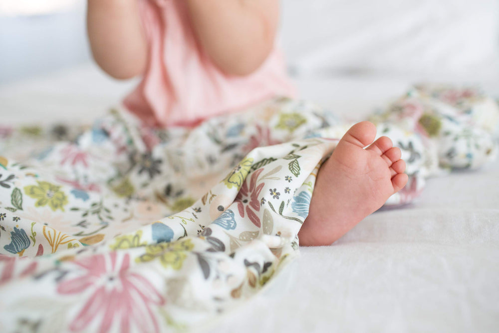 Copper Pearl olive blanket in stroller, lightweight design for travel and daily use.