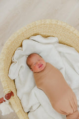 Copper Pearl pecan swaddle blanket used as nursing cover on the go.