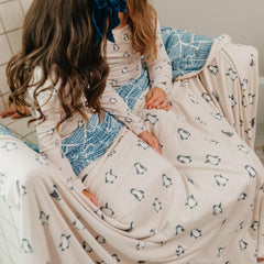 Copper Pearl Penguins Jumbo Quilt reversible design shown for versatile comfort