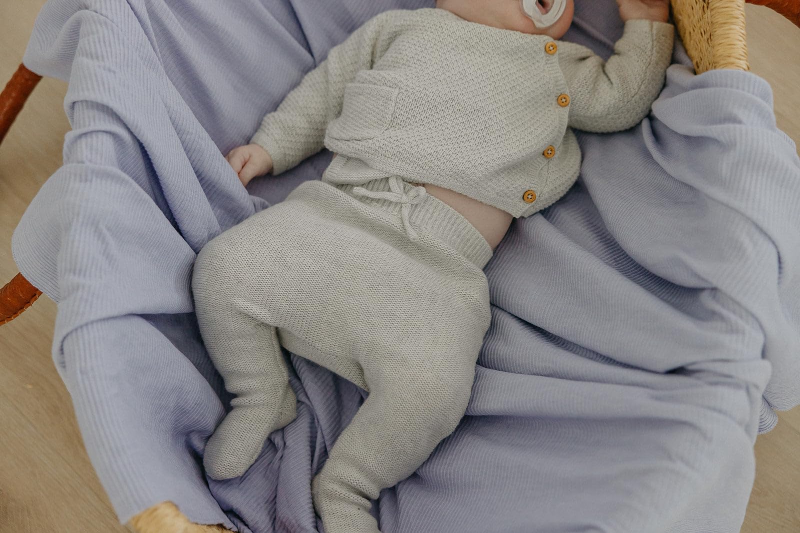 Copper Pearl Periwinkle swaddle used for toddler warmth while cuddling
