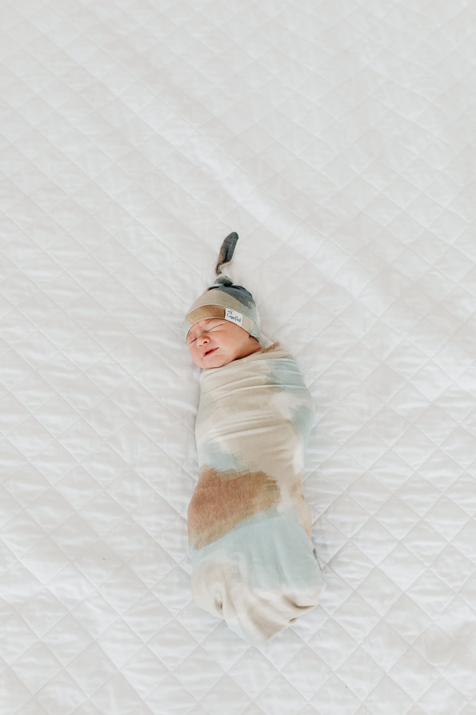 Copper Pearl Picasso large swaddle blanket folded neatly for gifting
