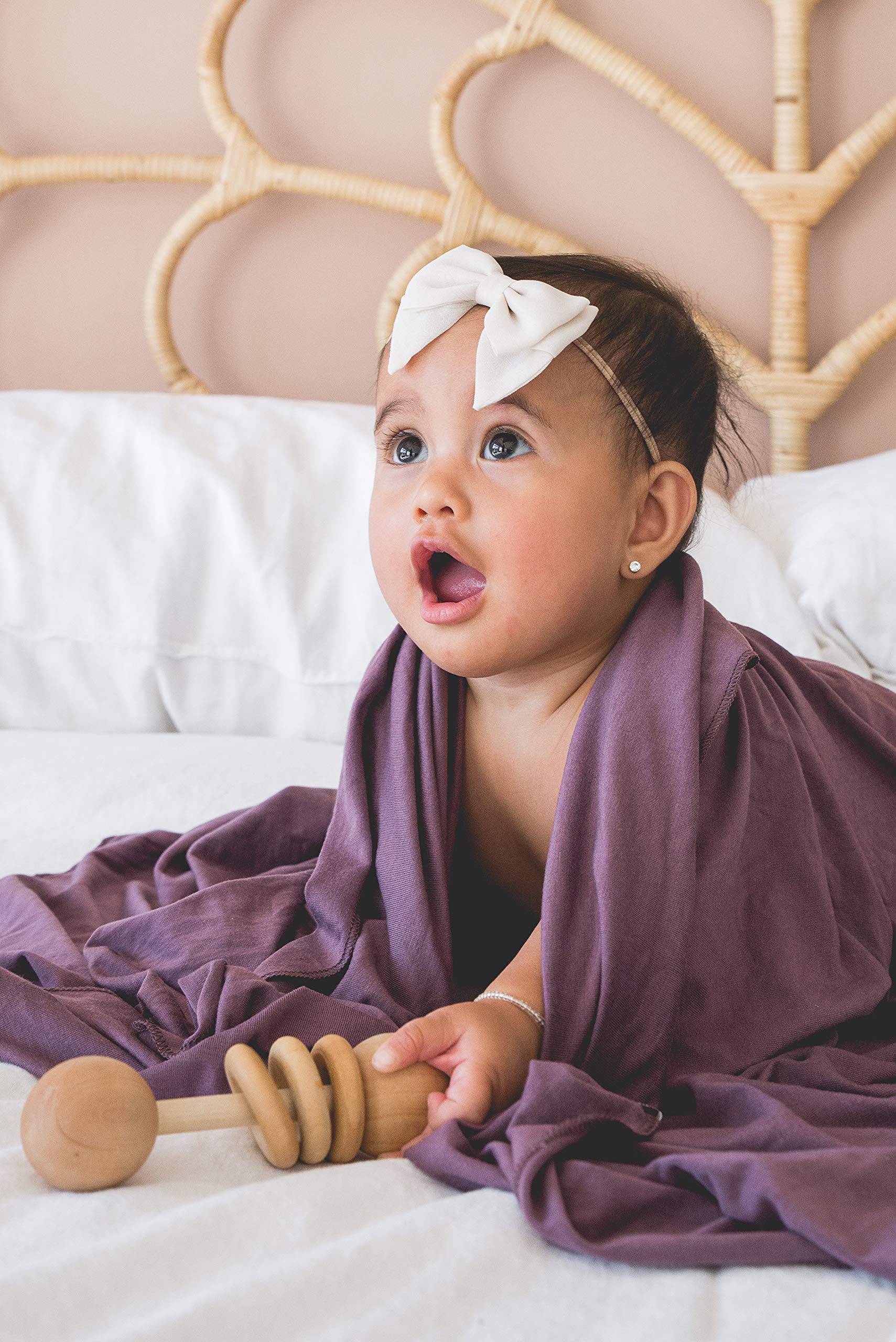 Copper Pearl plum swaddle blanket makes a thoughtful baby shower gift.