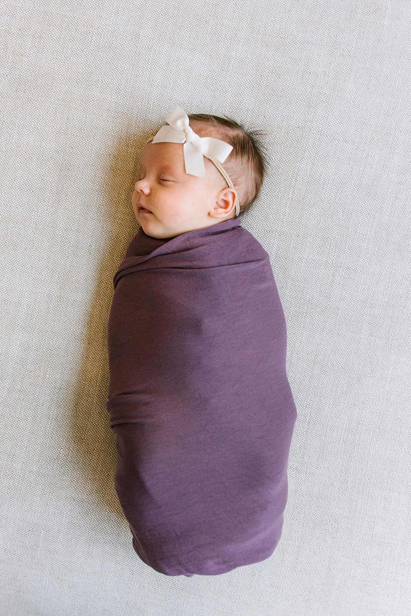 Copper Pearl plum swaddle blanket showcases modern prints for stylish outfits.