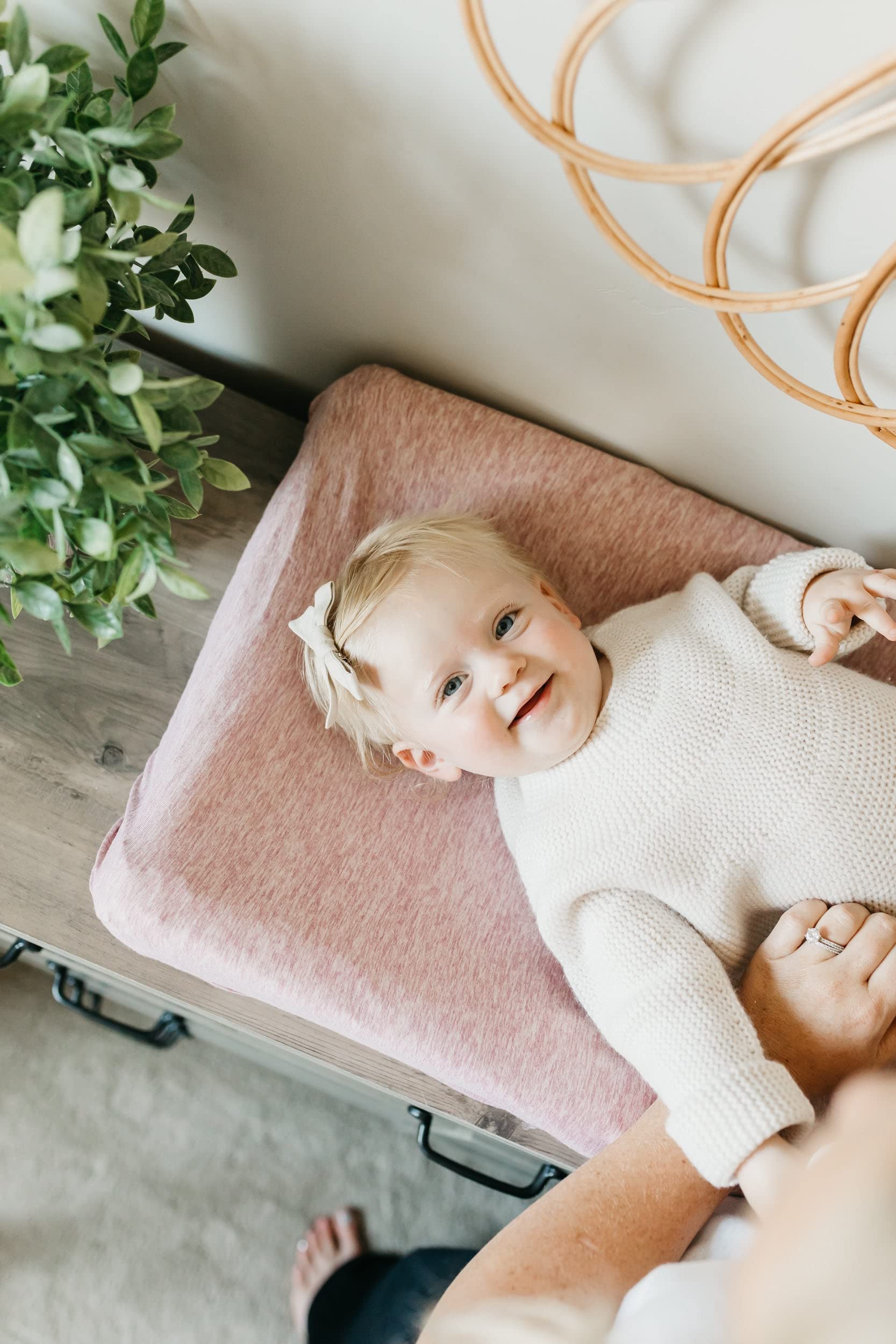 Copper Pearl premium knit cover coordinates with other nursery essentials for a cohesive look.