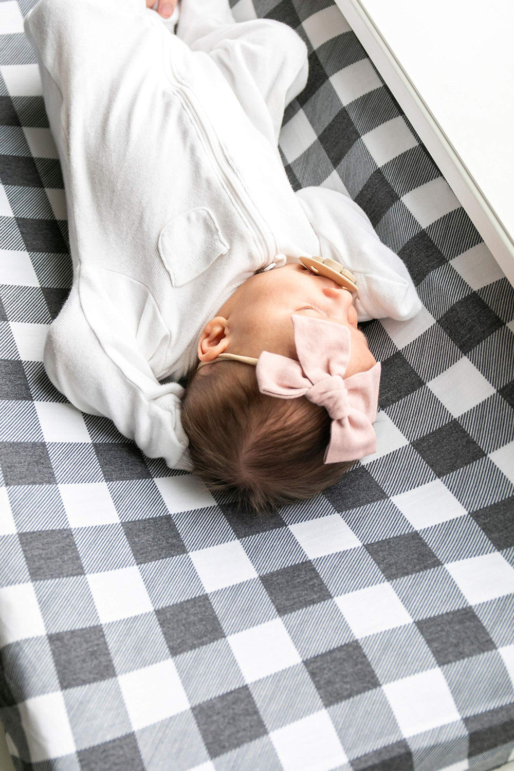 Cover coordinates with copper pearl nursery items for cohesive look