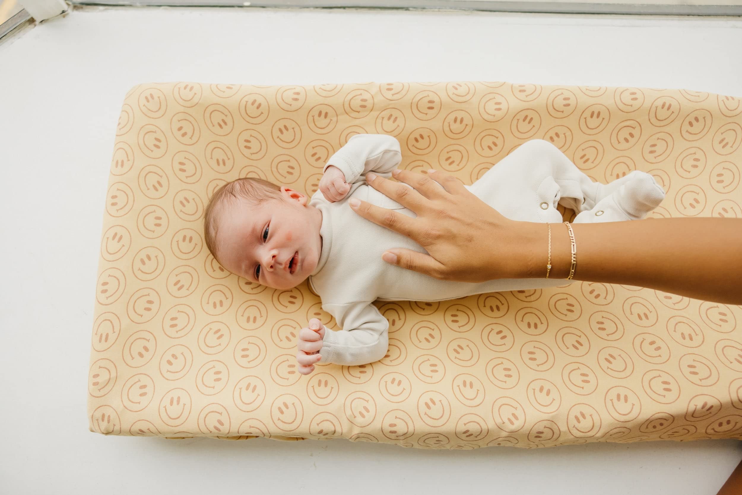 Copper Pearl changing pad cover remains soft and vibrant after washes