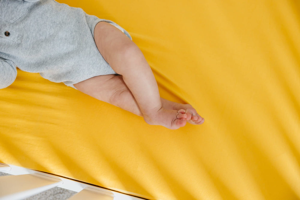 Copper Pearl banana knit crib sheet stays soft and vibrant wash after wash