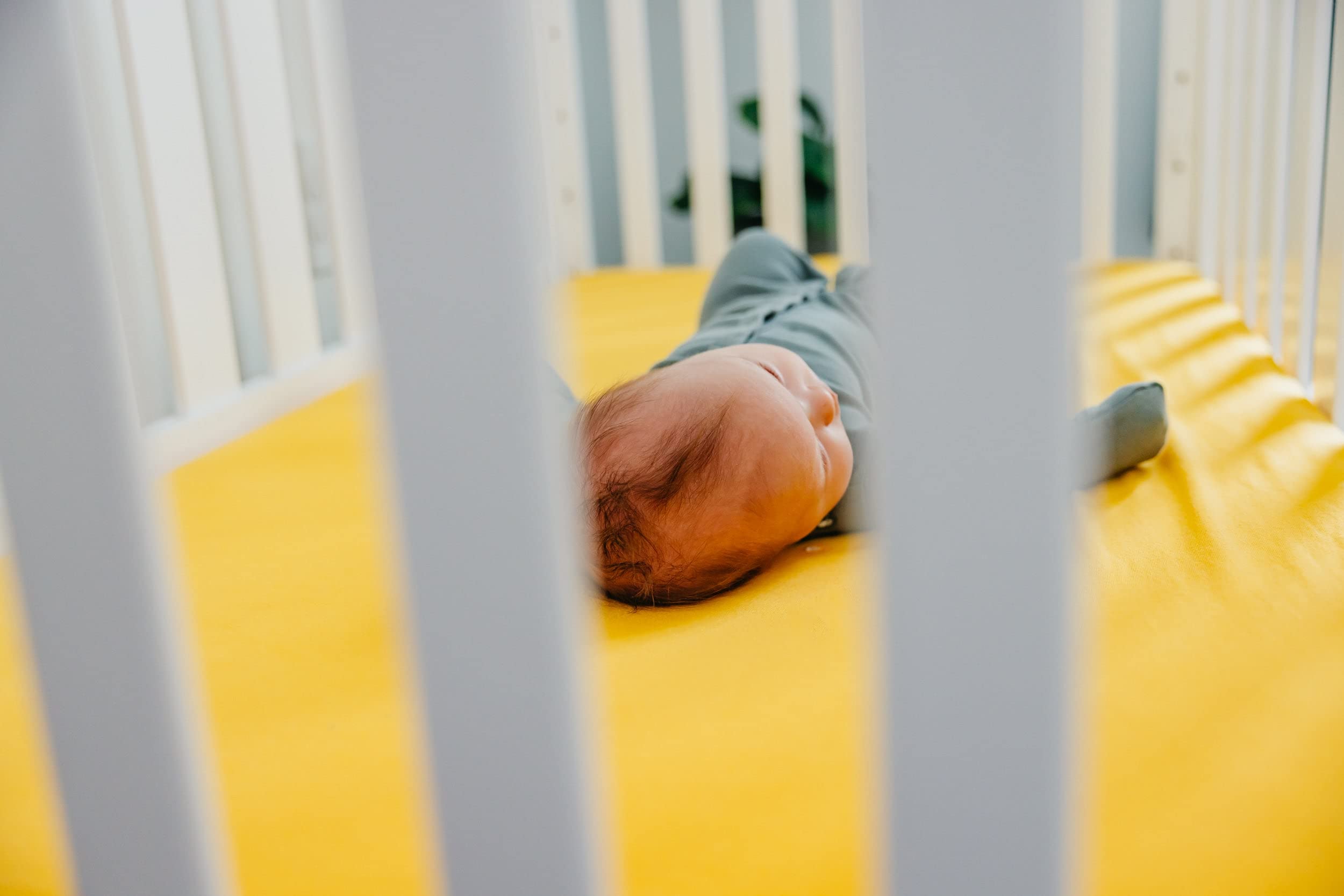 Copper Pearl banana knit crib sheet with durable elastic edges for a secure fit