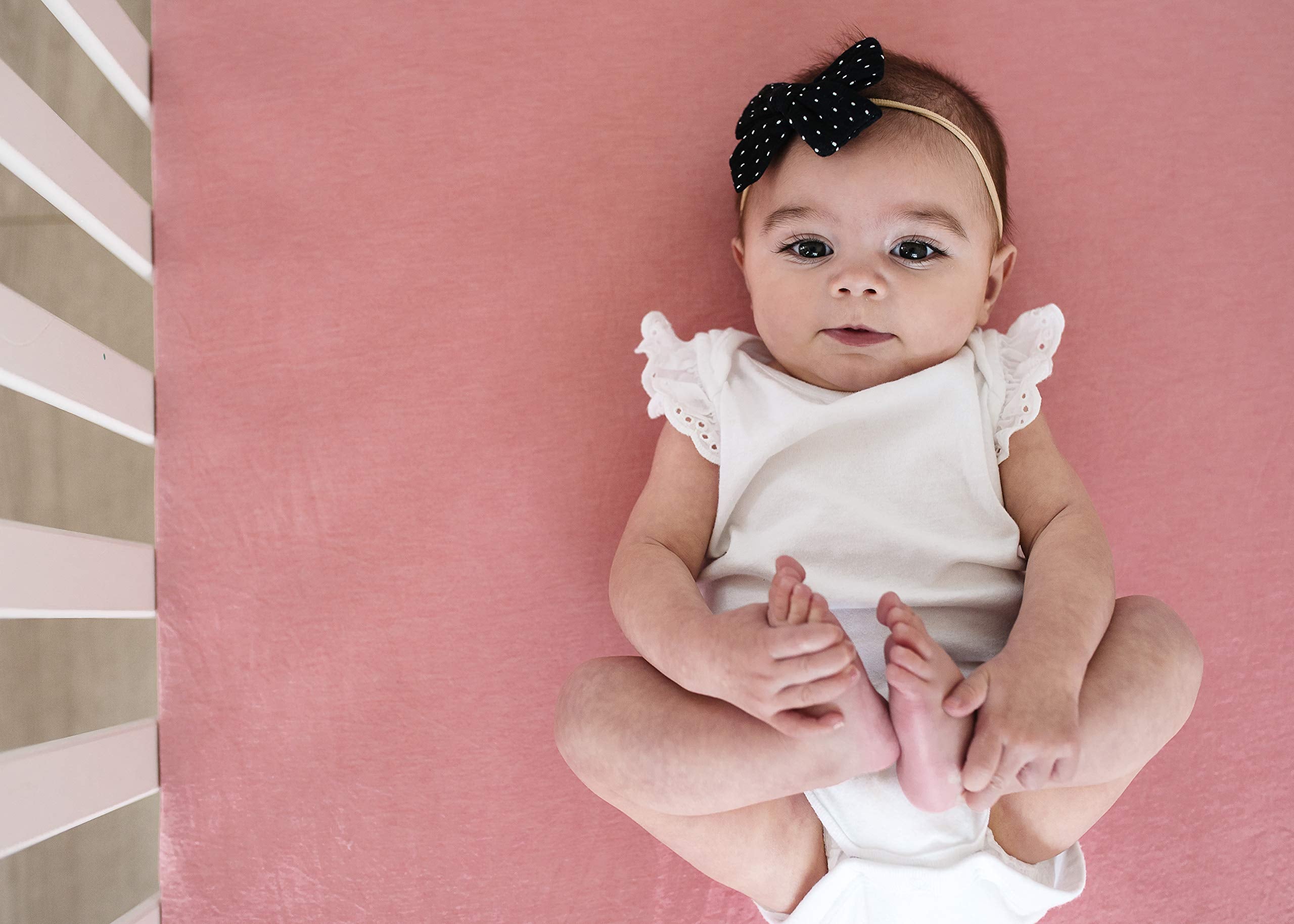 Copper Pearl Premium Knit Crib Sheet close up highlights soft surface and texture.
