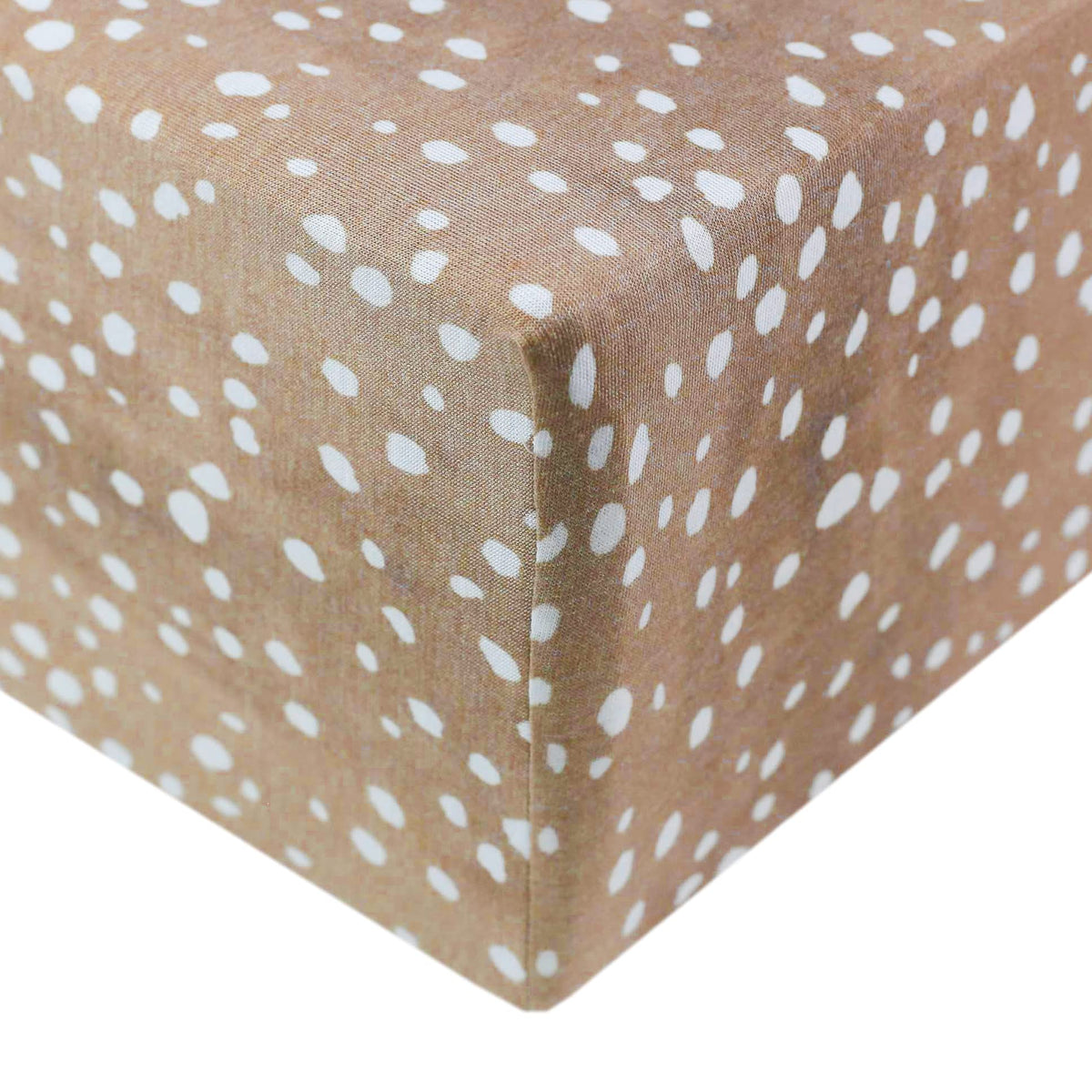 Copper Pearl premium knit crib sheet on standard mattress in fawn with snug fit.