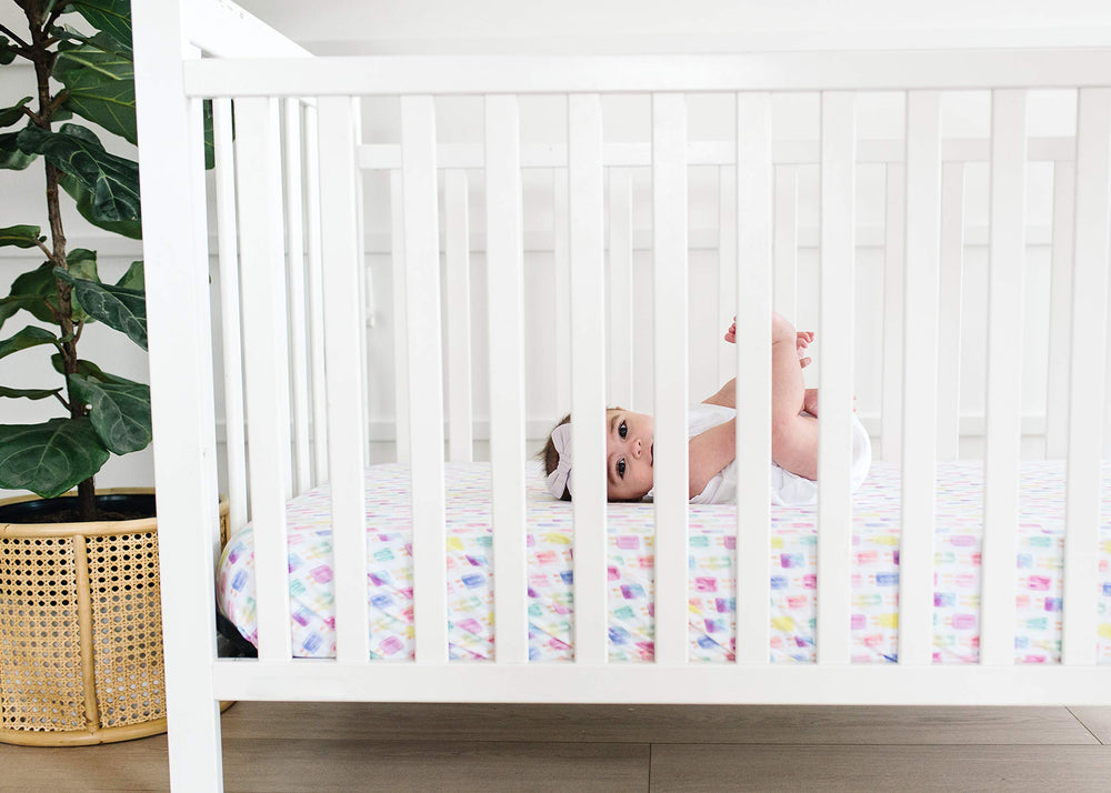 Copper Pearl packaging shows a ready-to-gift crib sheet for baby showers and registries