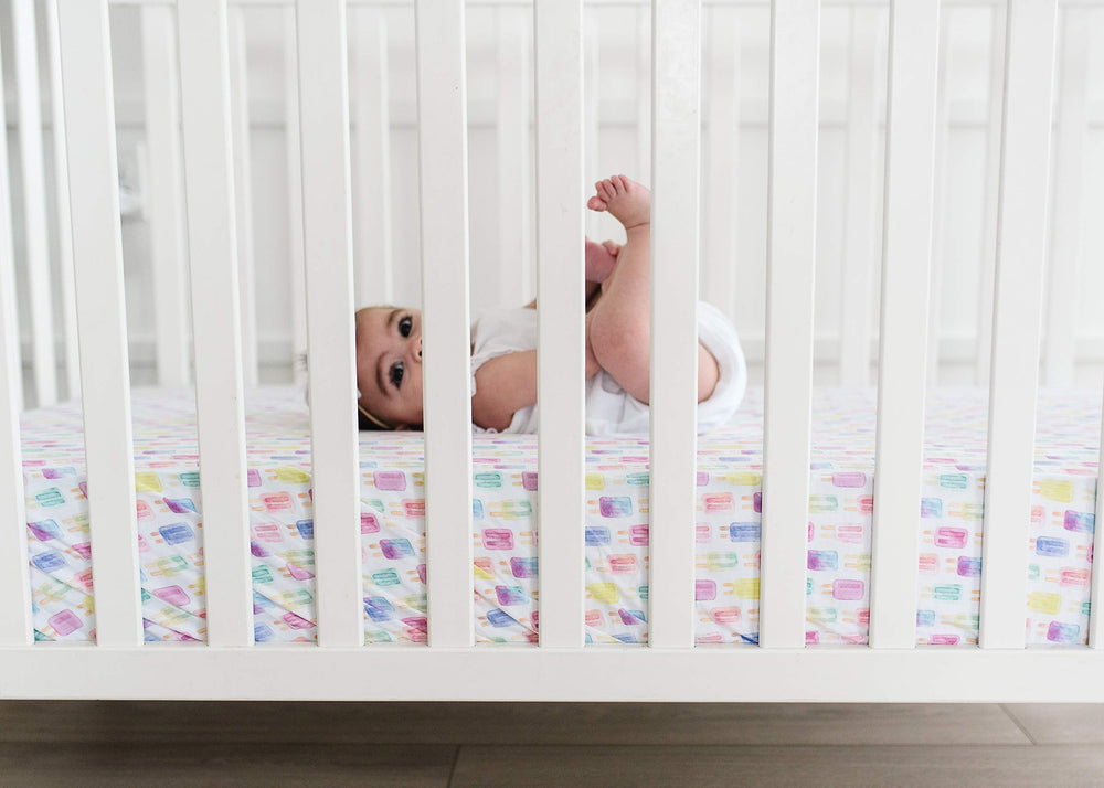 Copper Pearl knit crib sheet enhances nursery style with simple, modern design
