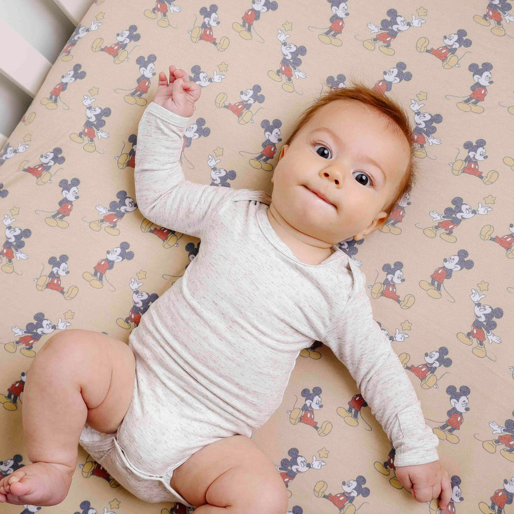 Copper Pearl premium knit crib sheet highlighting breathable fabric and easy care
