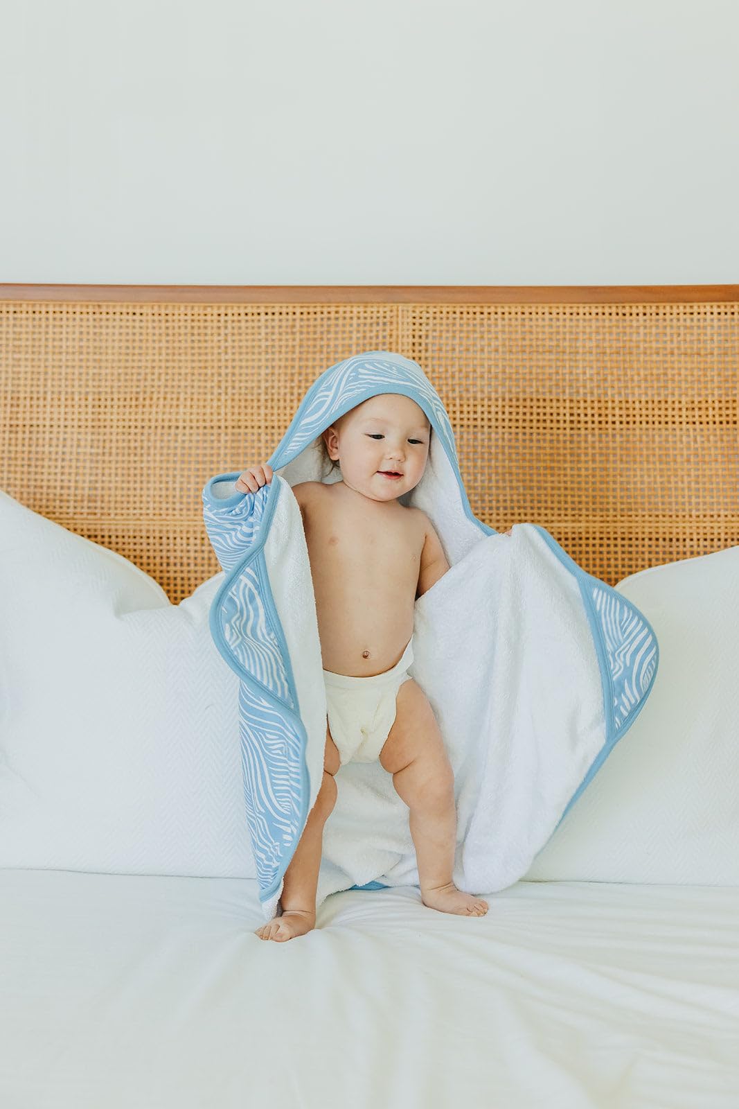 Copper Pearl Premium Knit Hooded Bath Towel Surf terry lining provides high absorbency for post-bath snuggles.