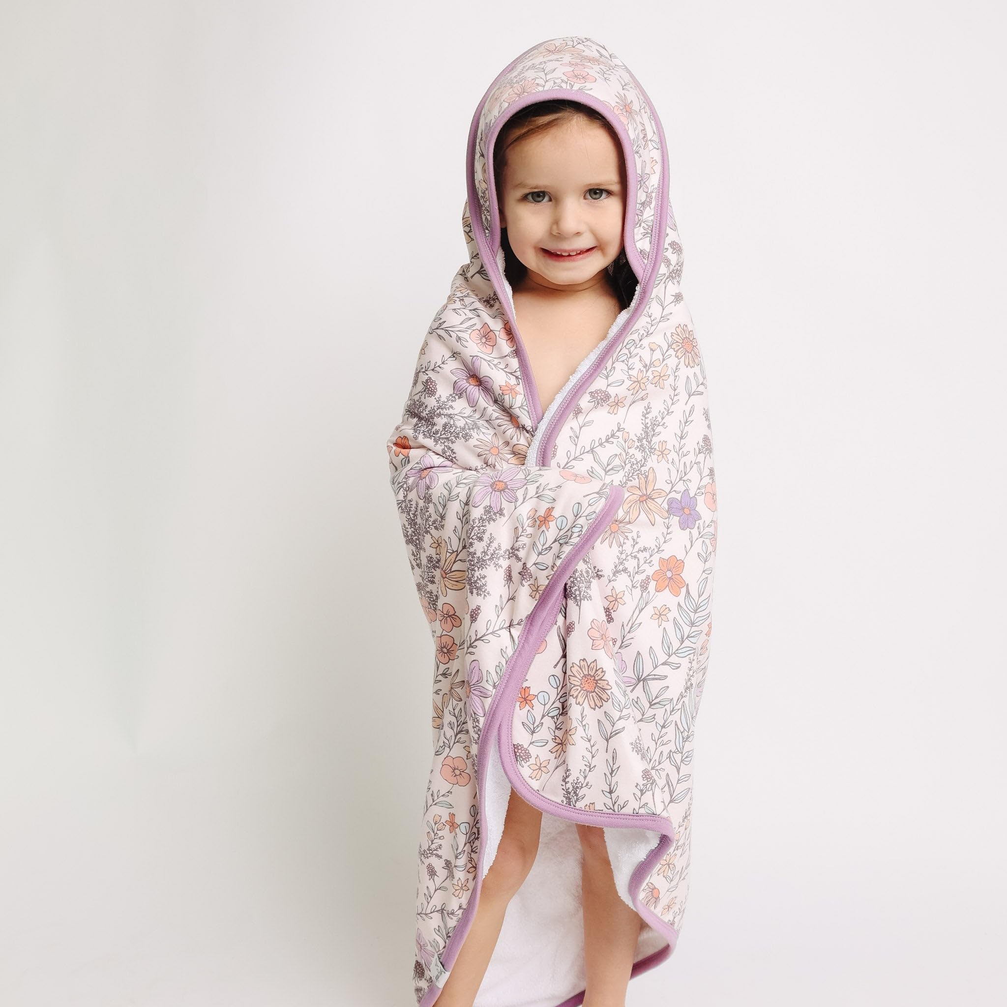 Copper Pearl hooded towel Flora pocket detail for tiny hand warmth.