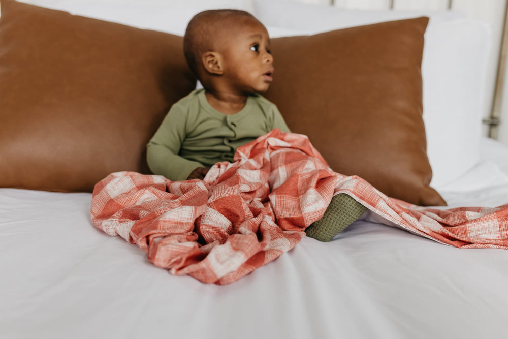 Copper Pearl Ralphie swaddle gift-ready packaging for new moms.