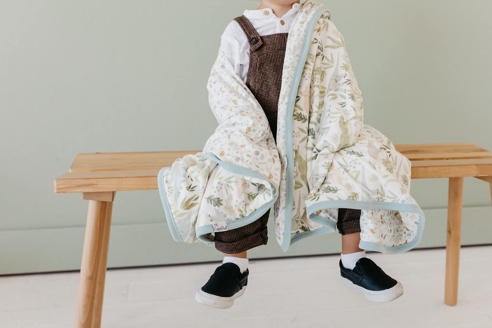 Copper Pearl Rex three-layer quilt multi-use blanket for crib and toddler bed.