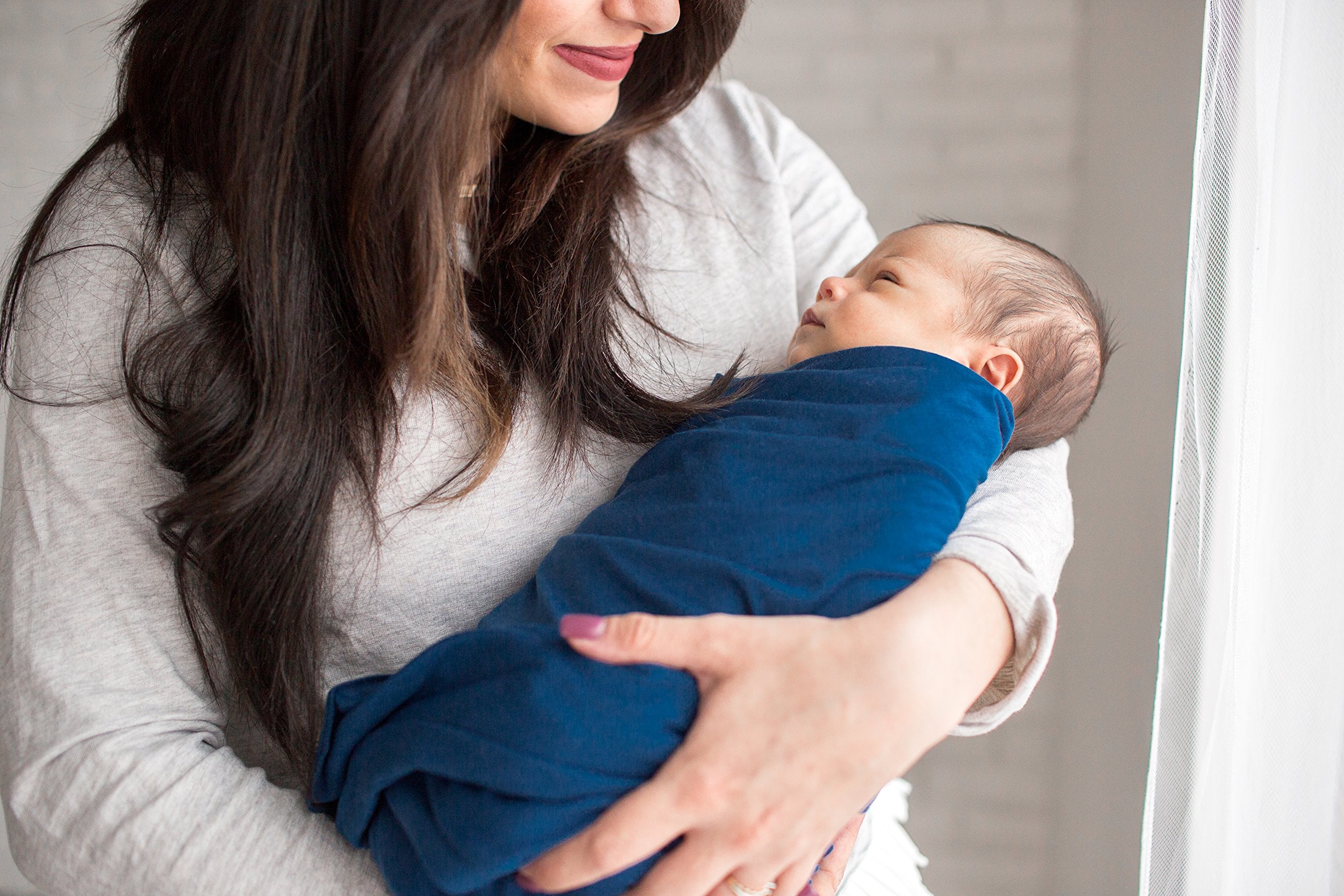 Copper Pearl River nursing cover in use for privacy during feeds.
