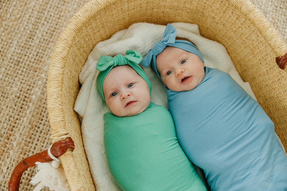 Copper Pearl Robin swaddle paired with outfits for stylish baby looks.